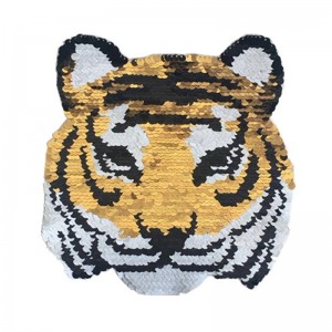 Blizgantys blizgučiai, dvipusiai apverčiami lygintuvai ant tigro rašto, skirti siuvimo reikmenims, drabužių dekoravimui