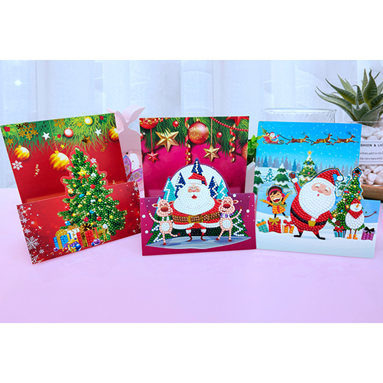 Tarjetas de felicitación pintadas con diamantes estilo navideño.